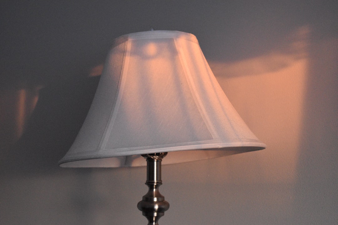 Enhance Your Space with a Modern Travertine Base Glass Globe Table Lamp